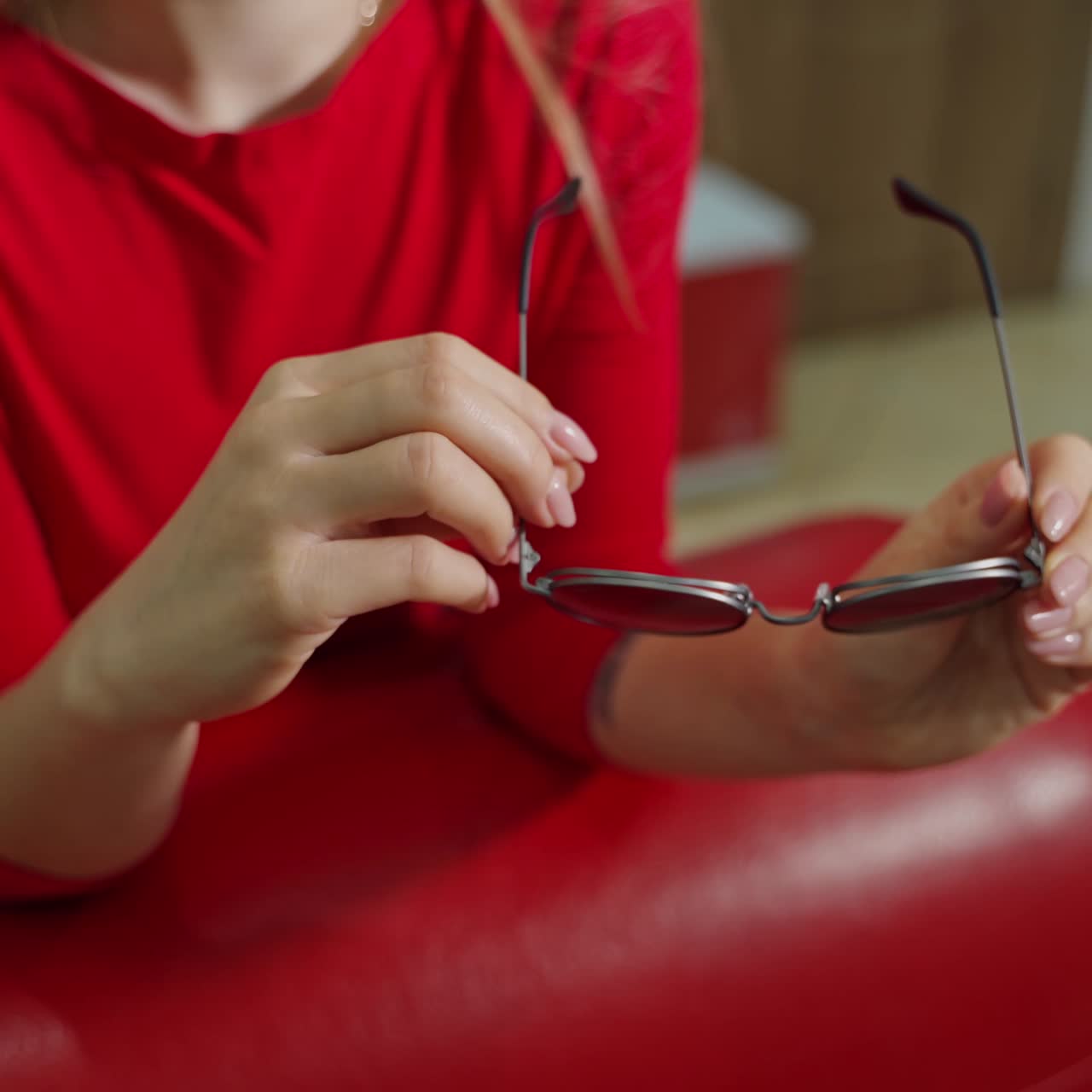 Woman buying sunglasses in shop
