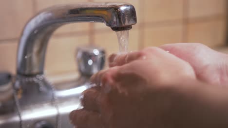 Washing-hands-hygienically-with-bar-of-soap-Slow-Motion