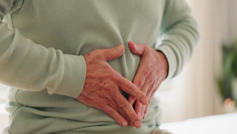 hands, stomach and senior person with pain in home