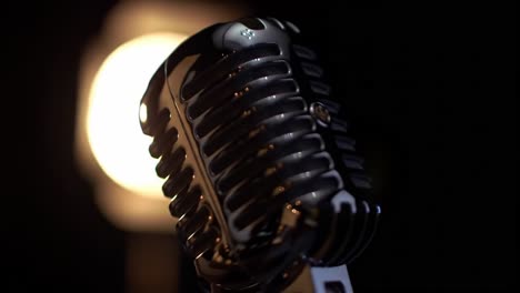 captivating close-up of a vintage microphone against a soft glow, highlighting its classic design and craftsmanship for an engaging audio experience