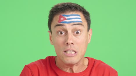 man with cuban national flag upset with a referee