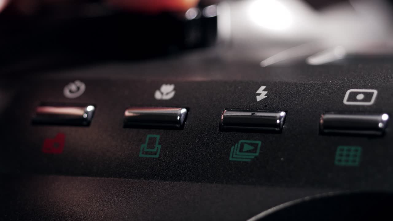 Macro close up of camera buttons while the power button is being pressed