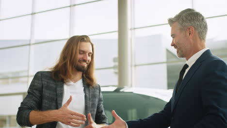 business deal at a car dealership