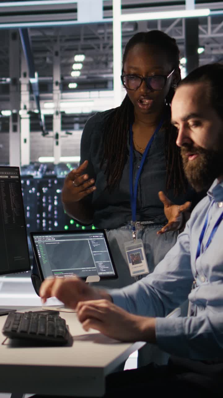 Vertical video Data center system administrators working together