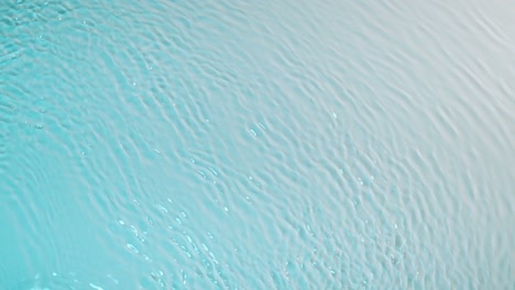 blue water surface texture rippled by wind. ripples and waves. clean water textured background, top view