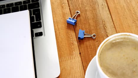 coffee with organizer and laptop