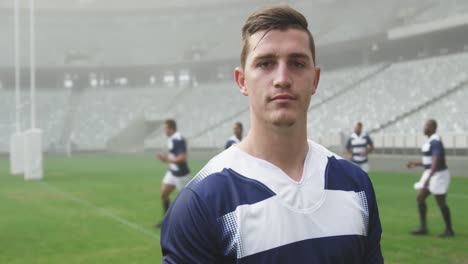 male rugby player standing in the stadium 4k