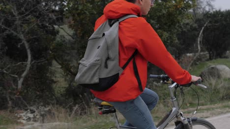 close up of young caucasian male cycling in slow motion