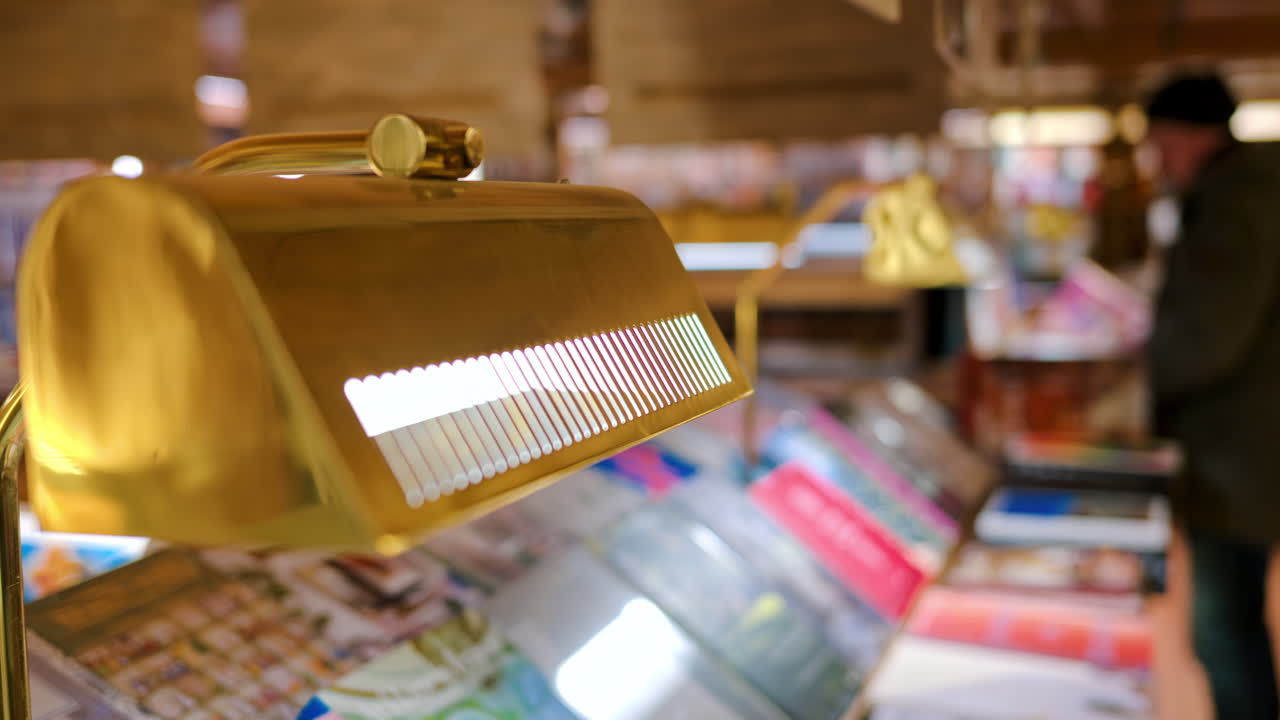 Close up of a lamp turned on at a library with a blurred background
