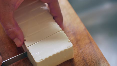 pov to the fresh tofu while being cut prepare for korean food
