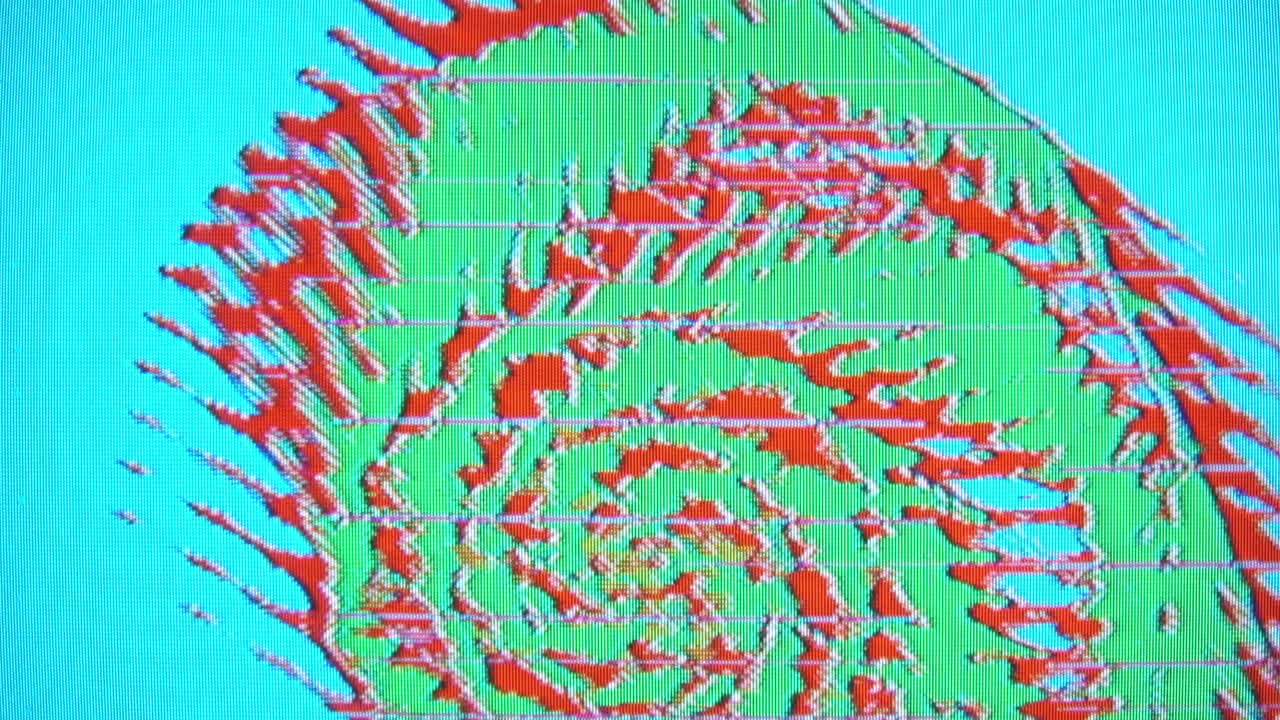 Spiral feedback pattern in green, cyan and orange