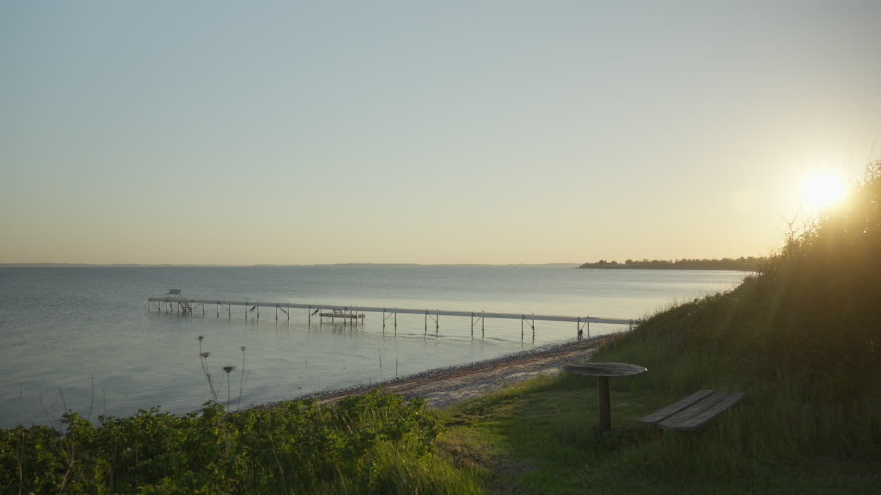 Scenic Pier at Water's Edge on Sydals Island: Beautiful Sunset at the Danish Coast