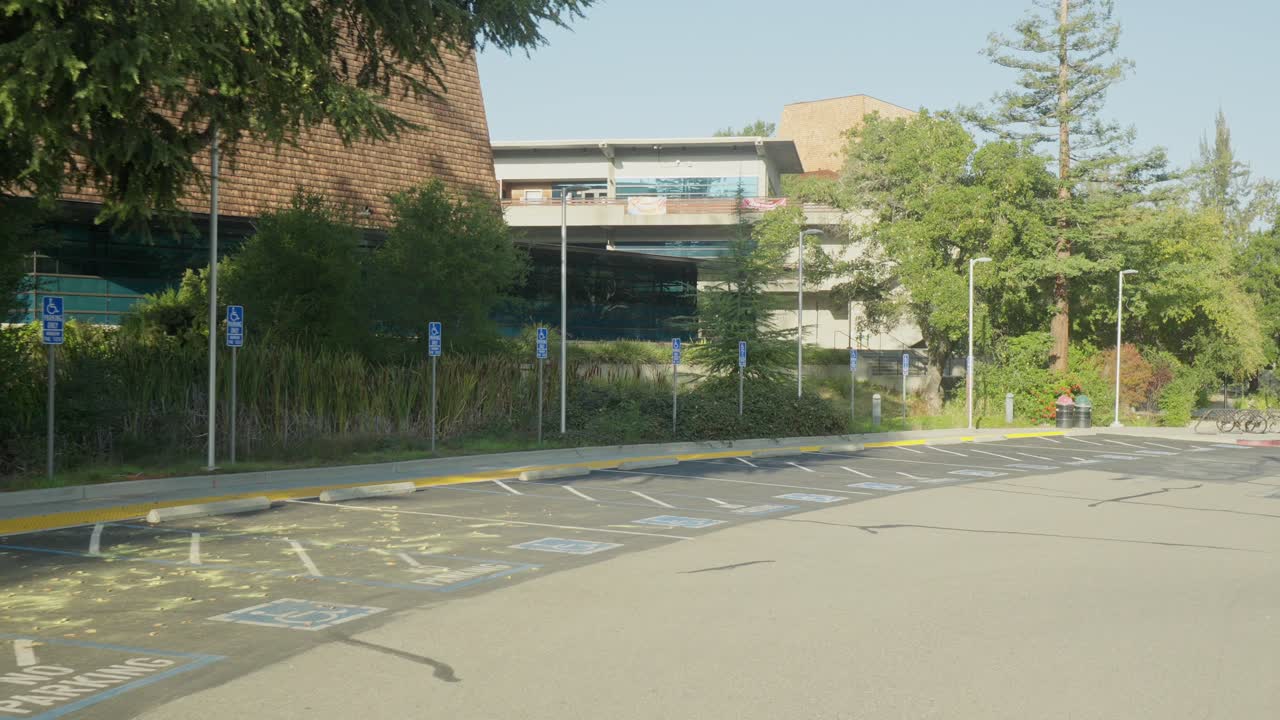 The camera glides across Foothill College, capturing terraced grounds and clean geometric structures, that emphasize the blend of academic spaces and natural hillside