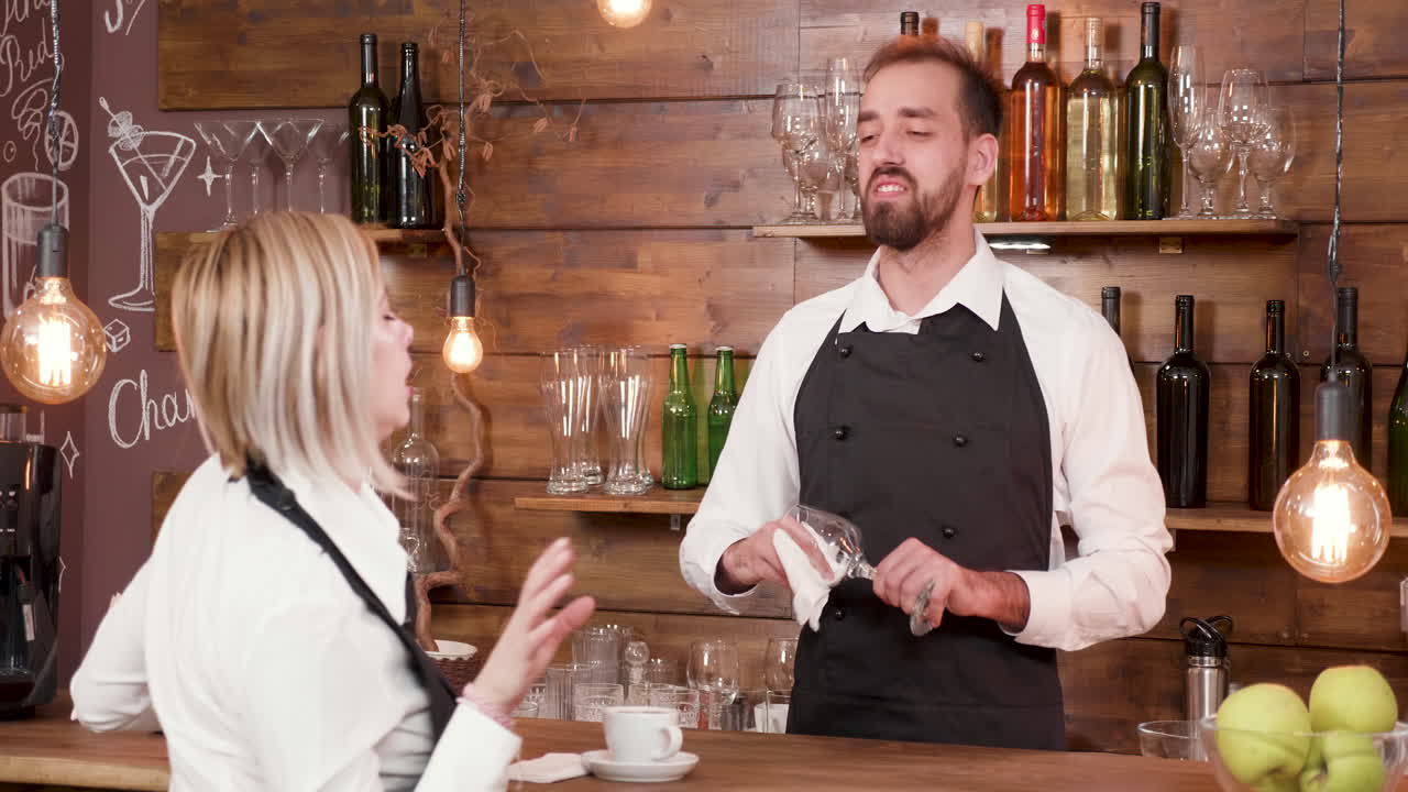 Bartender serving a customer in a bar