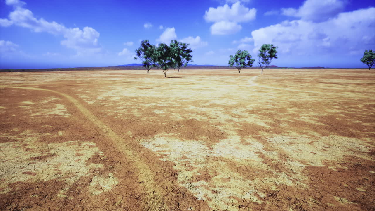 A vast landscape stretches with dry cracked earth under a bright blue sky