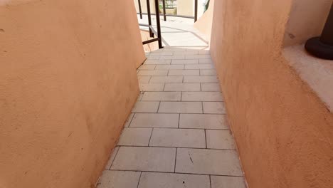 outdoor patio walkway with ramp and handrail