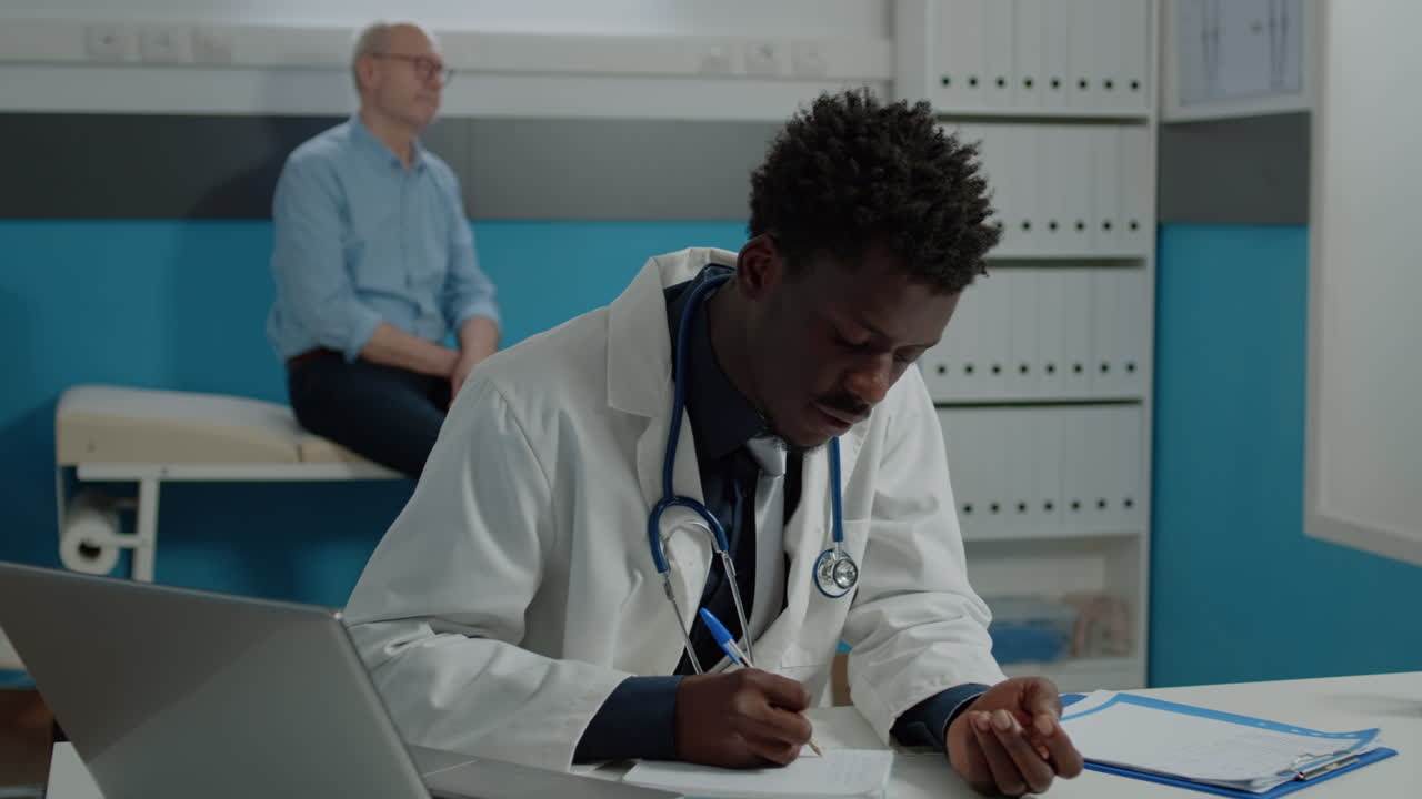 Person working as medic talking to senior patient