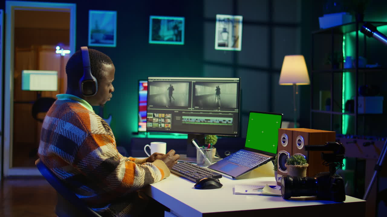 Man working on video editing at desk