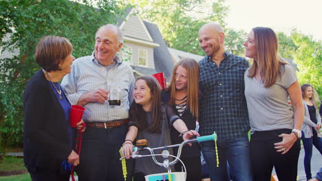 Group-of-neighbours-smiling-to-camera-at-a-block-party