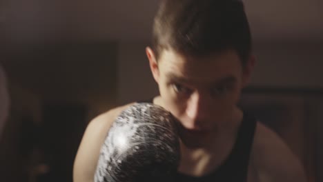 boxer gets in fighting shape at home with boxing training and punching techniques