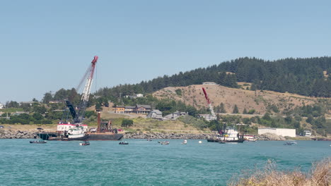 dredging ships on the rogue river in gold beach, oregon