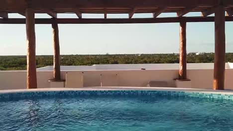 private pool on a rooftop in a beach apartment, jungle quintana roo