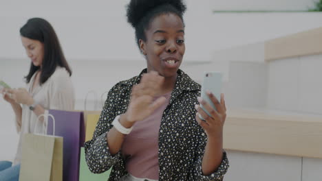 woman having a video call in a shopping mall