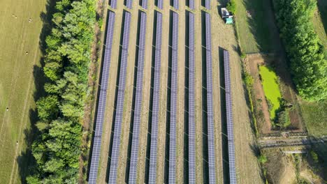 aerial shot of a rows of solar panels used to power a processing plant