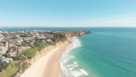 Aerial-of-Porto-de-Mos-beach-towards-Ponte-da-Piedade,-Lagos,-Algarve