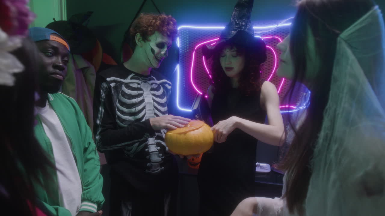 Halloween Costume Party with Pumpkin and Occult Book