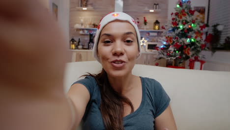 pov of festive woman using video call communication