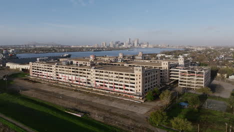 aerial flyover of an abandoned warehouse outside of new orleans