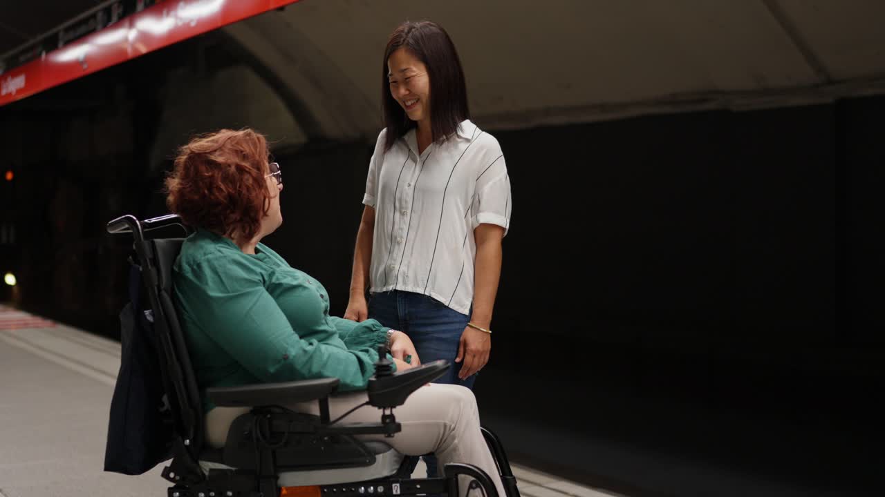 Women Talking in a Subway Station