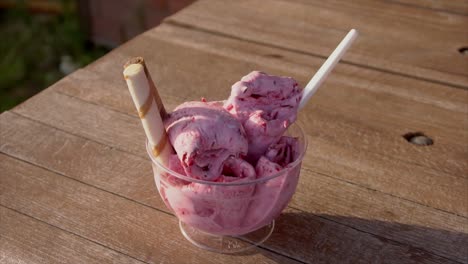 pink rolled ice cream with wafer stick