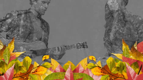 Animación-De-Hojas-De-Otoño-Sobre-Un-Hombre-Y-Una-Mujer-Caucásicos-Tocando-La-Guitarra-Y-La-Batería-En-Gris