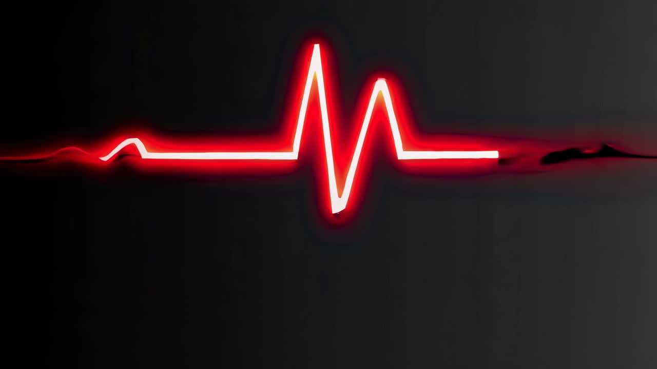 A glowing red heartbeat line on a dark background, captured from a straight-on angle