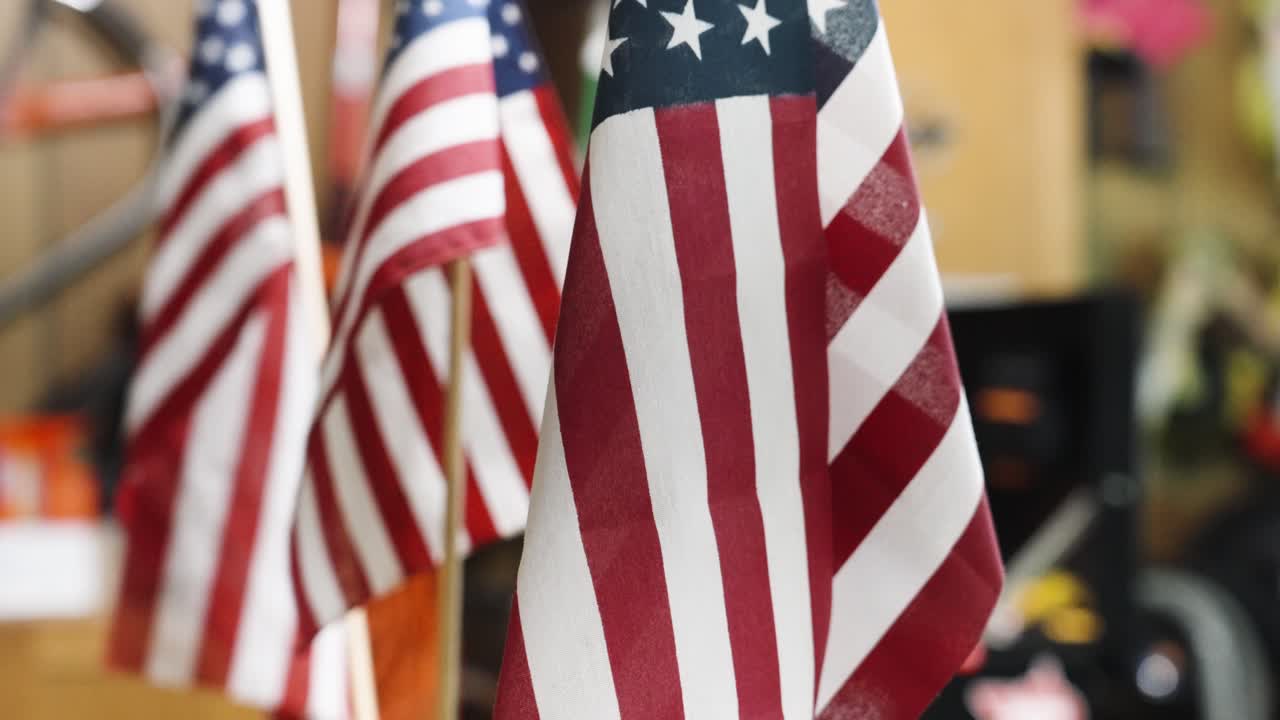 Tilt up over the stars and stripes of small flags