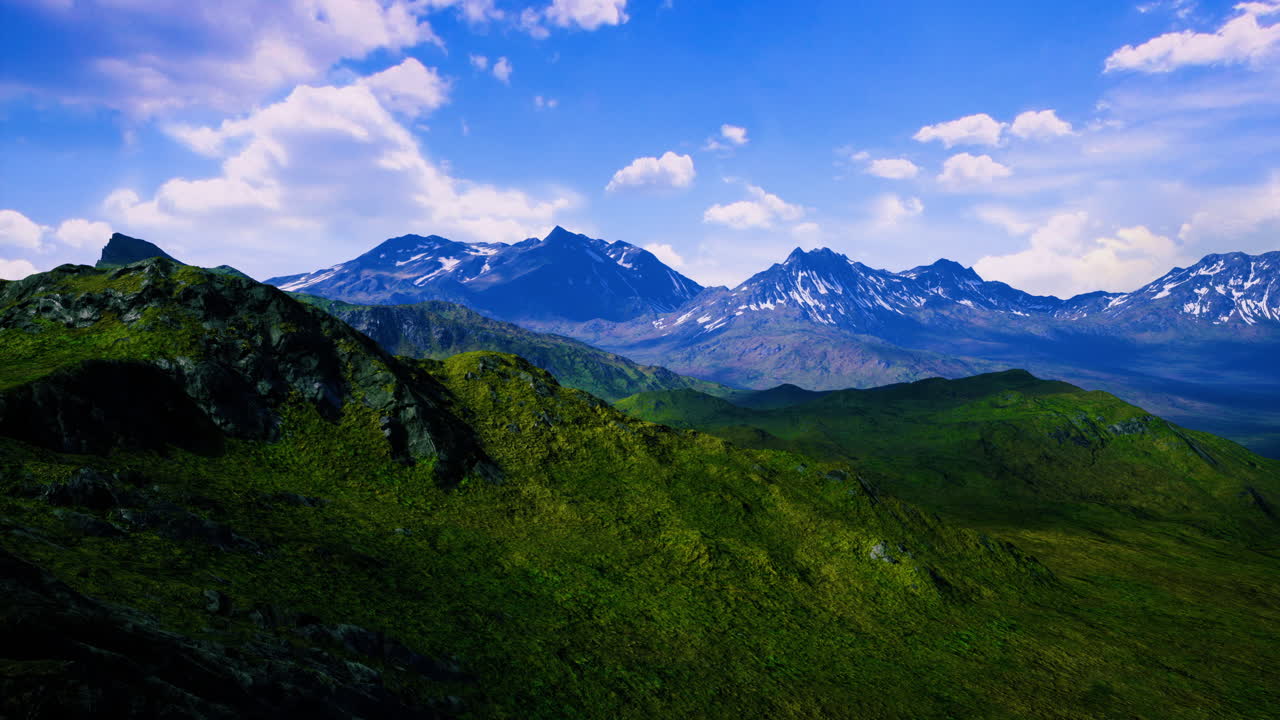 Majestic mountain landscape under a brilliant blue sky with fluffy clouds