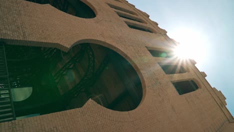 Vertical-view-of-a-filtered-sun-and-its-rays-at-the-Real-de-San-Carlos-bullring,-Colonia-del-Sacramento,-Uruguay