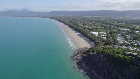 four mile beach with tropical rainforest coastline in port douglas, queensland, australia - aerial shot