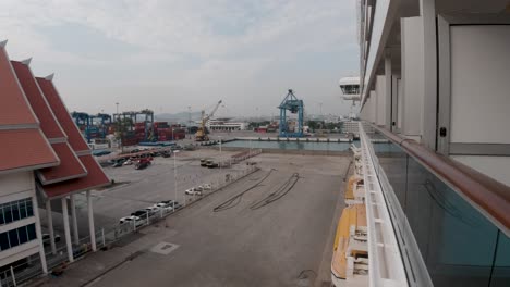 balcony view from a costa serena luxury italian cruise ship overlooking the docks at laem chabang, thailand