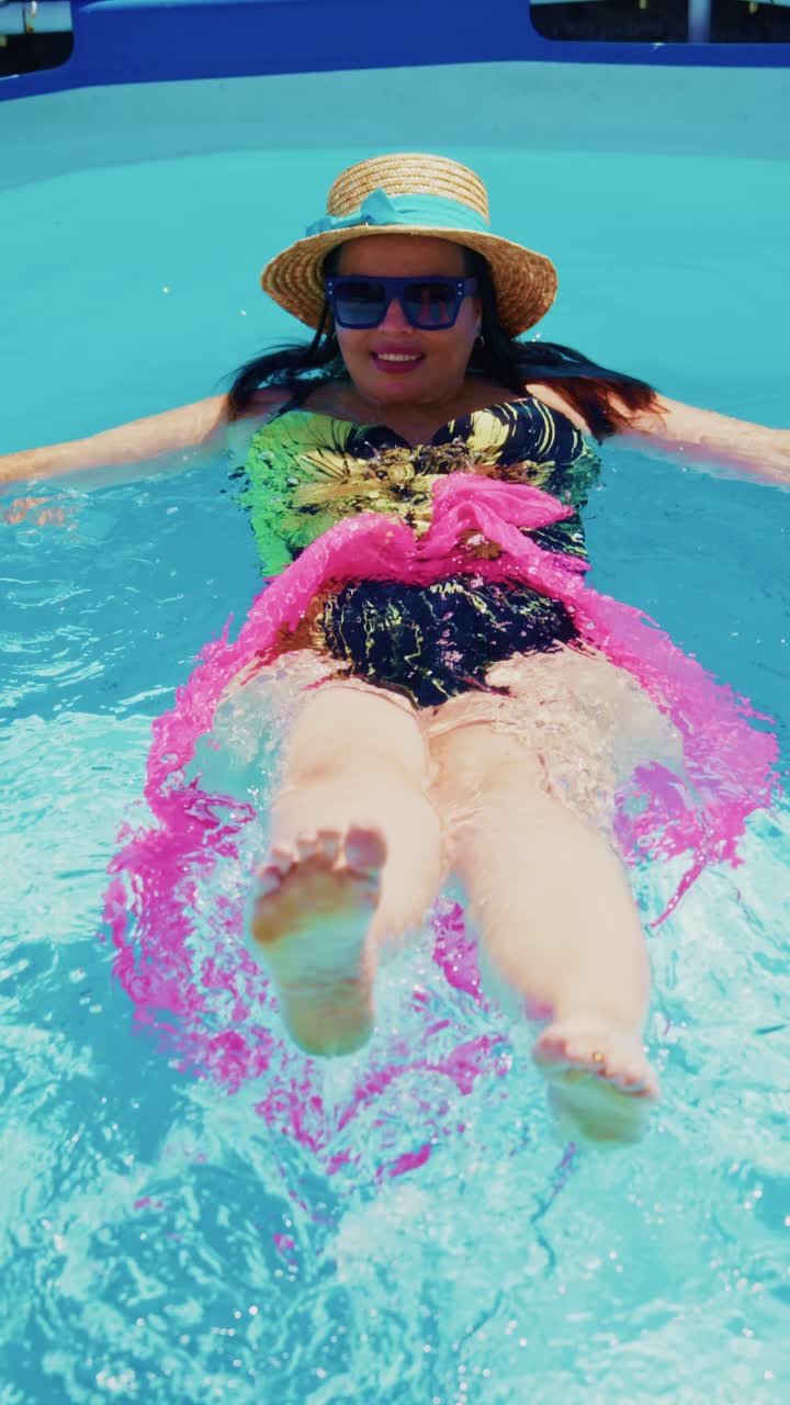 A Relaxing Day in the Pool: Enjoying the Sun and Water in Vibrant Swimwear with a Fun Pink Float and Stylish Accessories