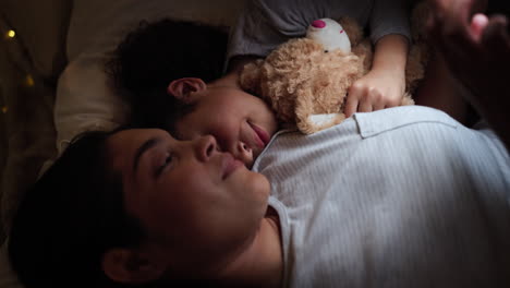 mother and daughter sleeping together