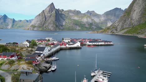 hamnoy village, harbour and fjords in lofoten islands, norway - aerial 4k