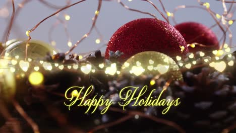 Animation-of-text,-happy-holidays,-in-yellow,-over-string-lights-and-christmas-decorations