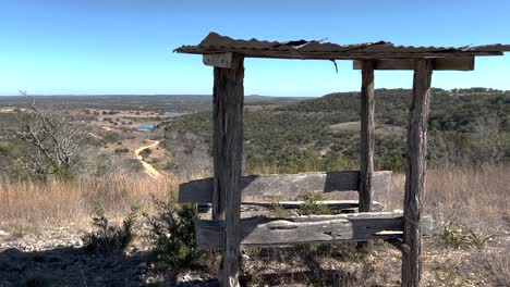 A-bench-and-trough-overlooks-the-Hill-Country-of-Texas,-icon-of-the-American-West