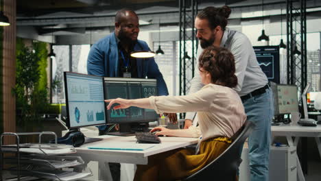 vertical video diverse corporate staff working together on report writing in the office