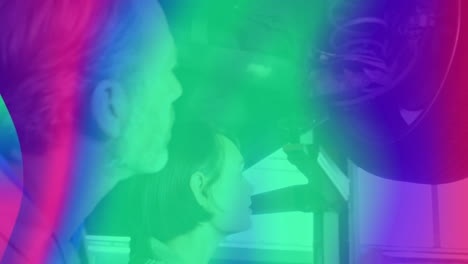 man and woman inspecting kitchen range hood in home improvement, showing animated airflow overlay