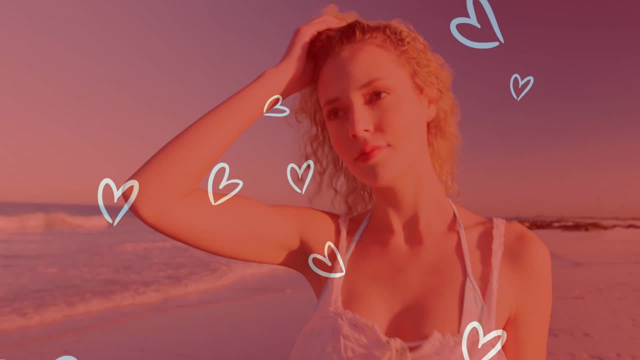 Woman brushing hair back on beach, with floating heart doodles boosting romantic marketing theme