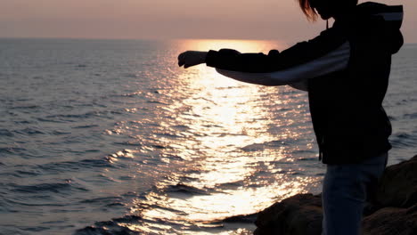 sunset on the coast with a woman